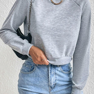 Perfee Raglan Sleeve Round Neck Cropped Sweatshirt