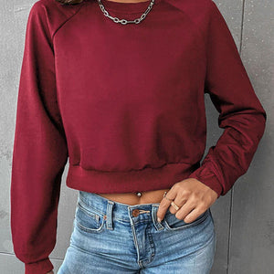 Perfee Raglan Sleeve Round Neck Cropped Sweatshirt